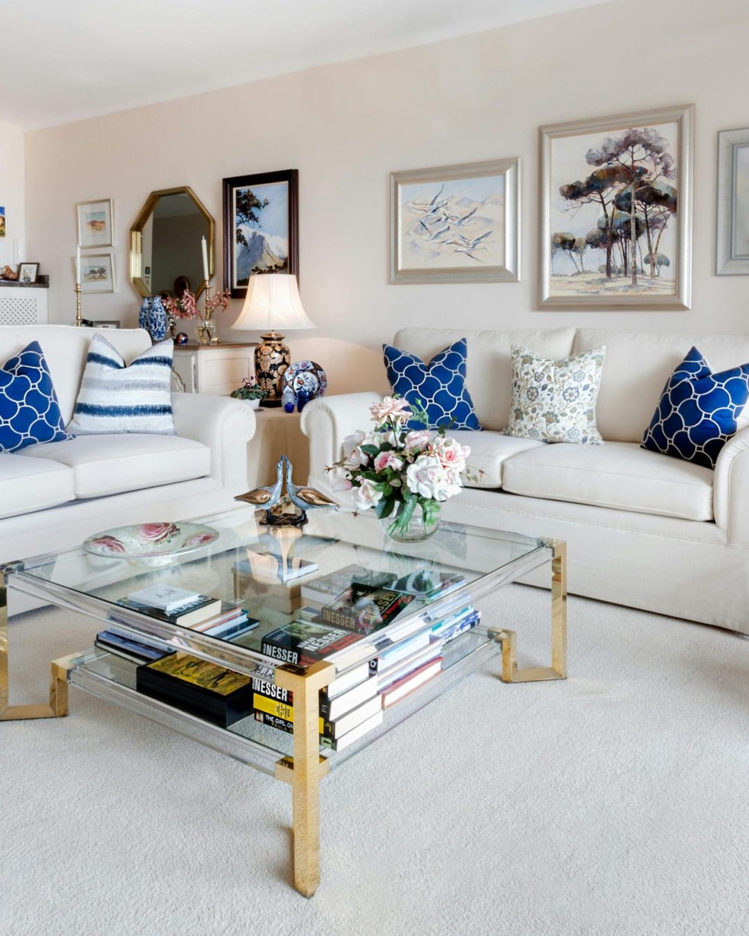 pexels-photo-1543447-1543447 Modern living room with stylish decor and comfortable white sofas.